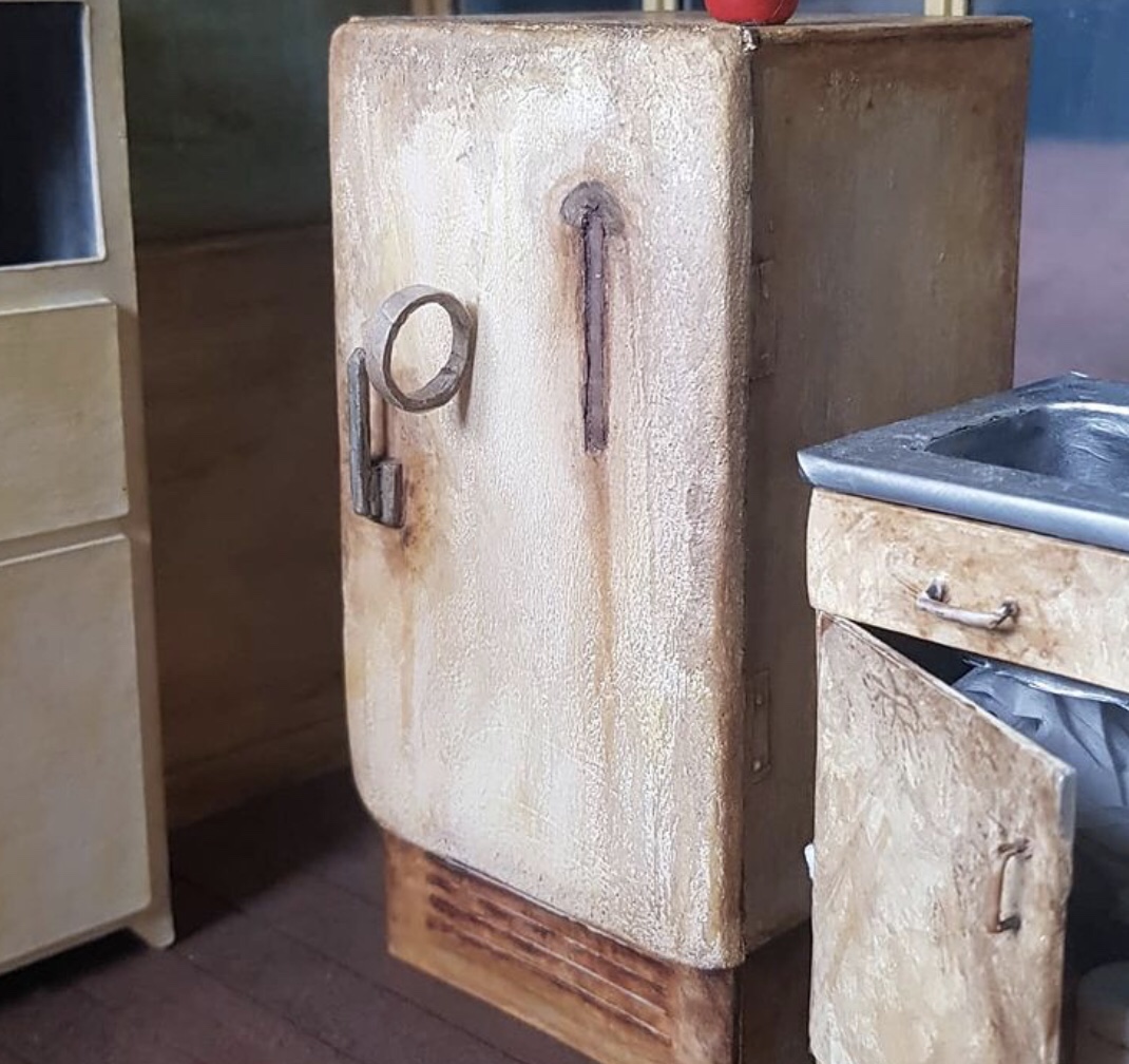 A piece of sellotape stuck to the fridge in the mini Bottom flat